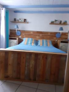 a wooden bunk bed in a small room at L'Oustalet in Beaumes-de-Venise