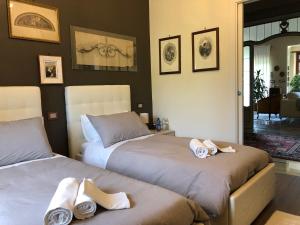 Un pat sau paturi într-o cameră la Villa Ciocca