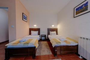 Postel nebo postele na pokoji v ubytování Hotel Zlatni bor