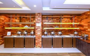 a kitchen with a counter with pots and pans at Pearl Park Beach Resort Private Limited in Port Blair
