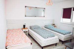 מיטה או מיטות בחדר ב-Casa Ryana Gilau