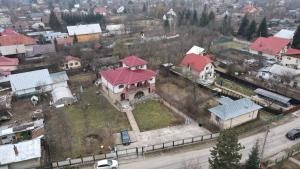 an aerial view of a house with a red roof at Anuța in Breaza