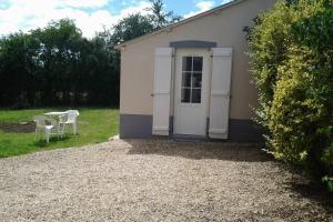 Zahrada ubytování Petite maisonnette atypique et son jardinet