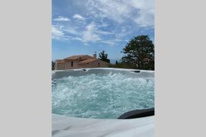 a jacuzzi tub with water in it at Rêves de vie, le "Port Miou" perle rare à Cassis in Cassis