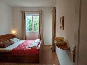 Postel nebo postele na pokoji v ubytování Villa Triton