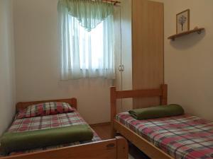Postel nebo postele na pokoji v ubytování Villa Triton