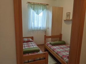 Postel nebo postele na pokoji v ubytování Villa Triton