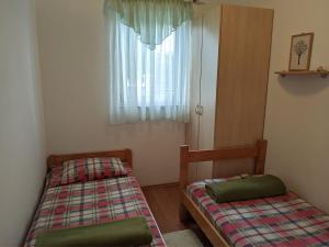 Postel nebo postele na pokoji v ubytování Villa Triton