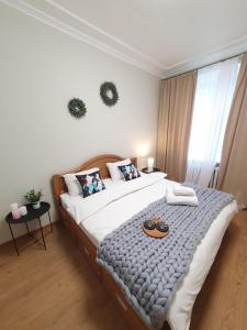 Ένα ή περισσότερα κρεβάτια σε δωμάτιο στο Inn Home Apartments-Olimpiysky Stadium area