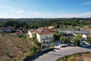 an aerial view of a house in a village at A Casa Amarela in Pinheiro de Coja