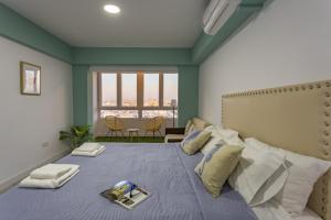 A bed or beds in a room at ATLANTICO Family Home by Cadiz4Rentals