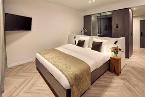 Postel nebo postele na pokoji v ubytování Van der Valk Hotel Beveren