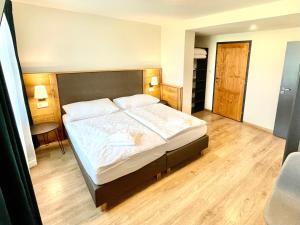Postel nebo postele na pokoji v ubytování Villa Pinus Slovenský raj - Hotel Čingov dependance
