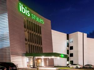 a large building with a clock on the front of it at ibis Styles Sao Mateus in São Mateus