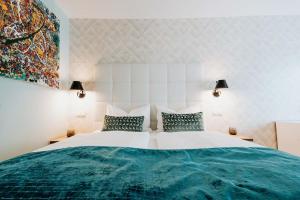 Ein Bett oder Betten in einem Zimmer der Unterkunft Abbate Boutique Hotel
