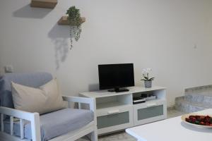 TV a/nebo společenská místnost v ubytování Estancia en Complejo Tamarán - Playa del Inglés