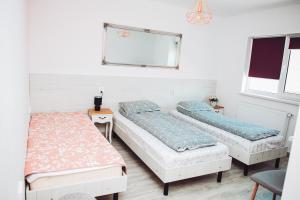 מיטה או מיטות בחדר ב-Casa Ryana Gilau
