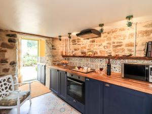 O bucătărie sau chicinetă la Bonny Bits Cottage