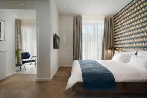 Ліжко або ліжка в номері Dominic Smart & Luxury Suites - Edition