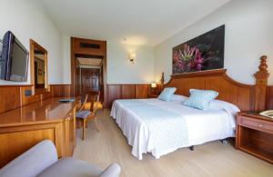 Кровать или кровати в номере Hotel Vallemar