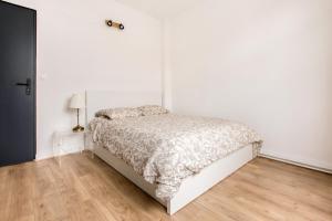 Katil atau katil-katil dalam bilik di Appartement Croisé Laroche 2 (12min de Lille)
