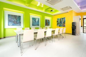 a conference room with a long table and chairs at Solar Villas in Hong Kong