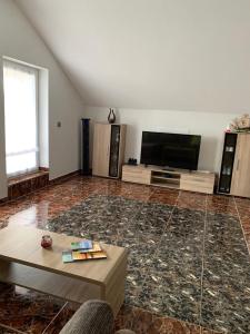 TV a/nebo společenská místnost v ubytování FeWo Weitblick