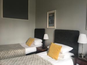A bed or beds in a room at The Conifers