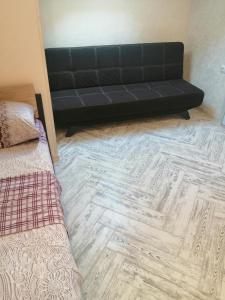 Gulta vai gultas numurā naktsmītnē Guest House Kamysh