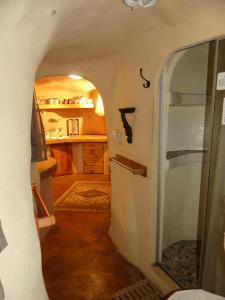 a hallway of a room with a door in a house at Rockwood Earth Lodge in Champagne Valley