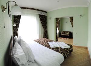 Ліжко або ліжка в номері Готель Золота Форель