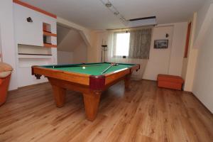 a room with a pool table in a room at Casa din Deal in Sibiu