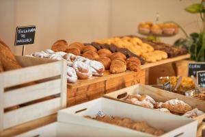 a bakery with many different types of donuts and pastries at Nura Santa Ponsa & Spa in Santa Ponsa