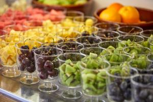 a bunch of glasses filled with different types of fruit at Nura Santa Ponsa & Spa in Santa Ponsa