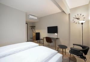 Un televizor și/sau centru de divertisment la Nordic Hotel Lagos