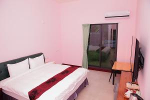 Giường trong phòng chung tại Yuan Homestay