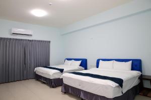 Giường trong phòng chung tại Yuan Homestay