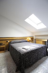 Ένα ή περισσότερα κρεβάτια σε δωμάτιο στο Hotel Croce Di Malta