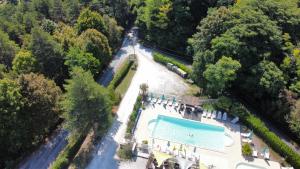 an overhead view of a swimming pool in a park at Les Chalets d'Argentouleau in Sarlat-la-Canéda
