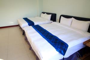 Giường trong phòng chung tại Yuan Homestay