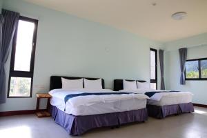 Giường trong phòng chung tại Yuan Homestay