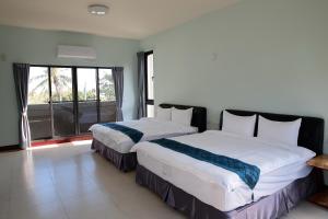 Giường trong phòng chung tại Yuan Homestay