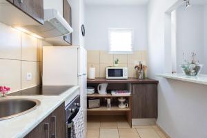 Kuchyň nebo kuchyňský kout v ubytování Paradise Beach Suite