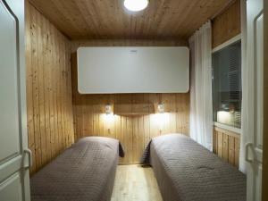 Postel nebo postele na pokoji v ubytování Lomavuokra, Alpine Chalets Levin Kalle A2