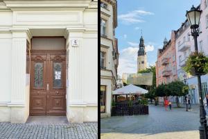 a building with a large wooden door on a city street at Apartament Riesling in Zielona Góra