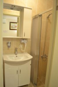 a bathroom with a sink and a shower at New Fatih Hotel in Istanbul +72 photos