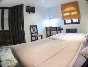 Posteľ alebo postele v izbe v ubytovaní Green Peaks B&B Country House Alojamiento Rural