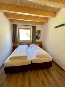 A bed or beds in a room at Sartu Apartments
