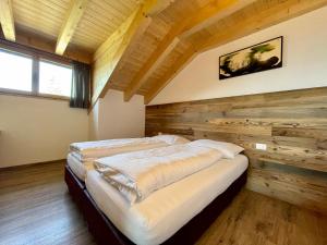 A bed or beds in a room at Sartu Apartments