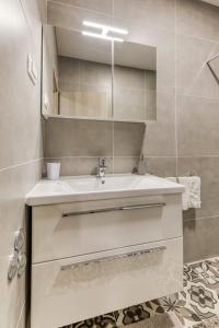 Kúpeľňa v ubytovaní Apartmani Leptir + 37 fotografií
